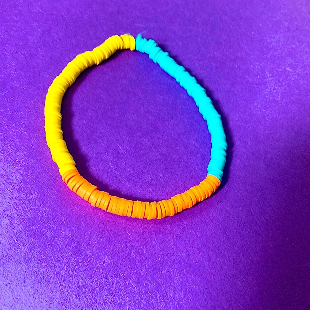 Homemade anklet. Sky, blue, orange, and yellow clay beads.